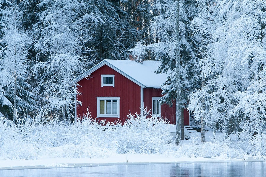 Winter time red sauna cottage