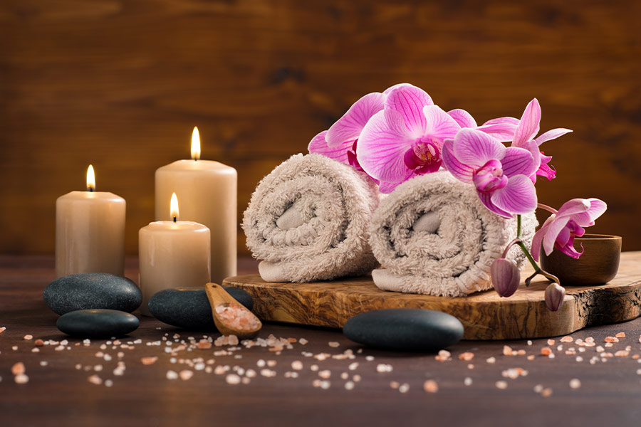 Spa setting with brown rolled towel
