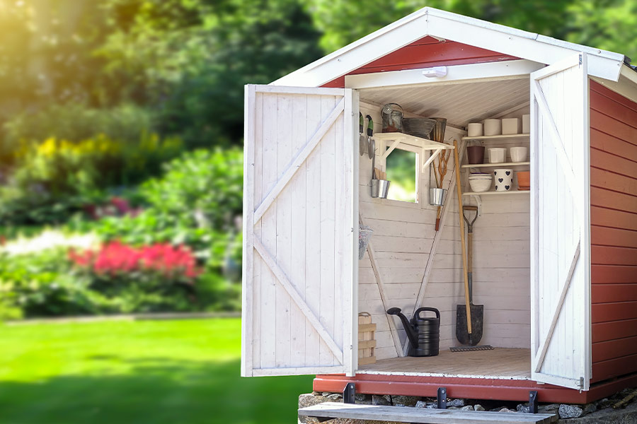 Storage shed with gardening tools