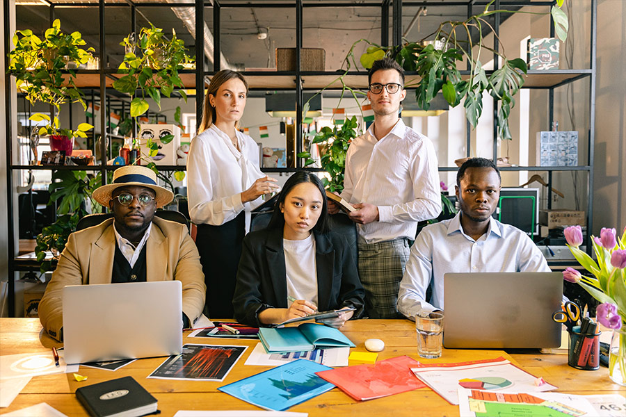 People in the office taking a group photo