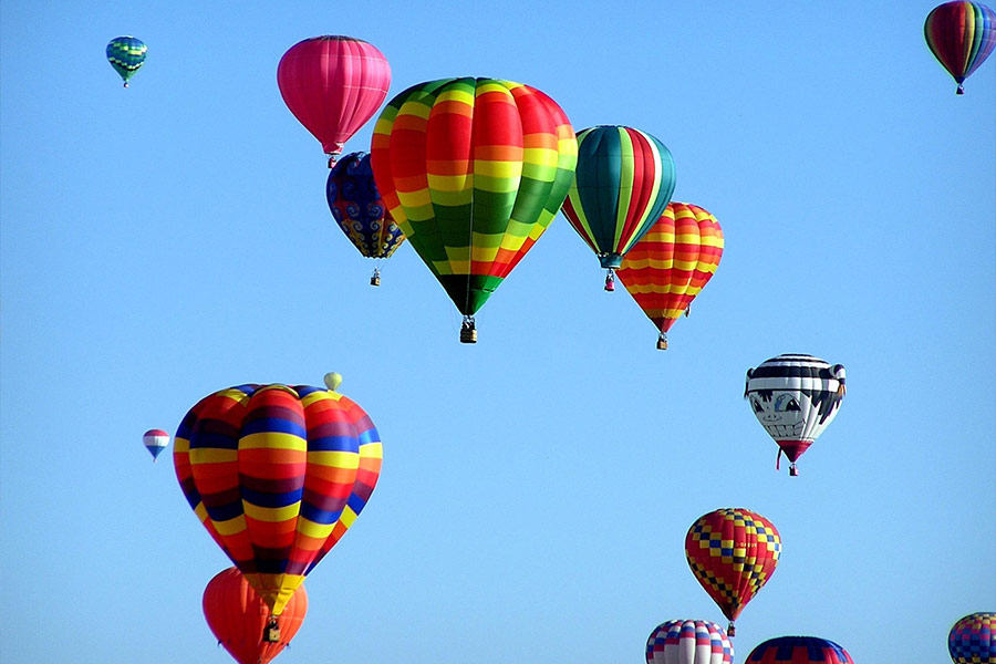 Red green hot air balloon during daytime