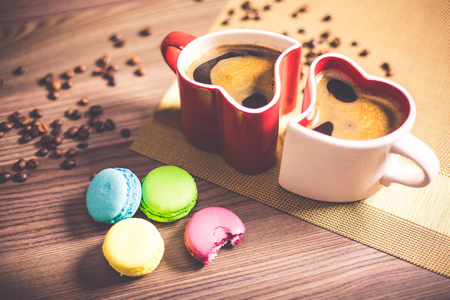 Black coffee with colorful macaroons