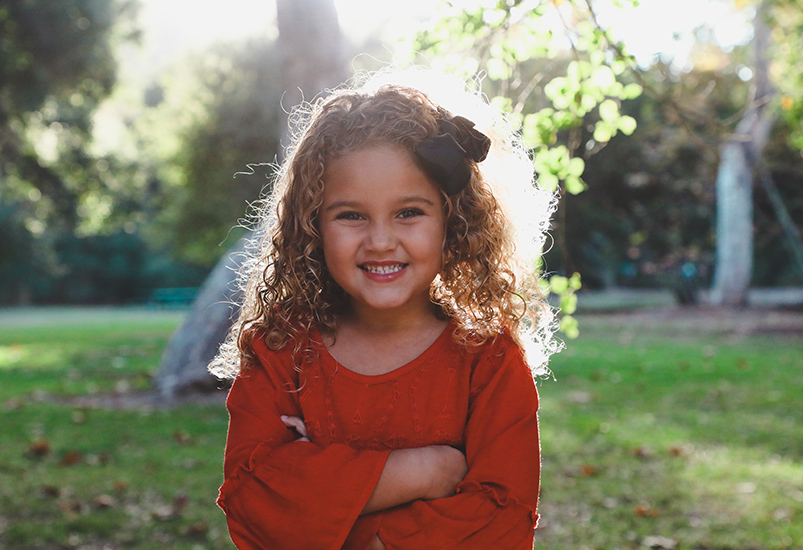 Girl in red long sleeved top