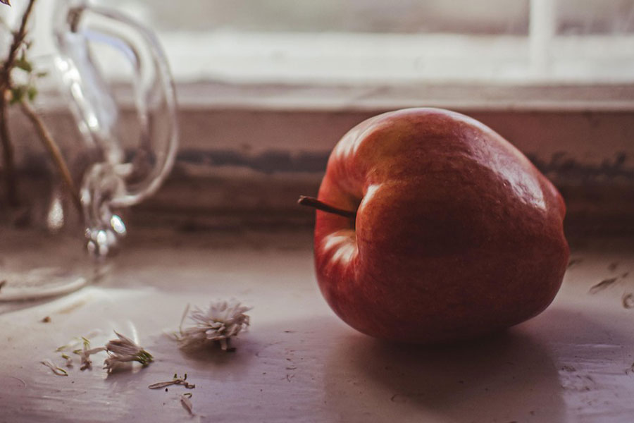 One single red apple