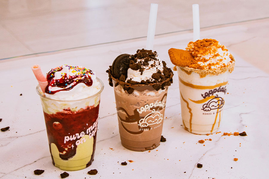 Three decorated milkshakes