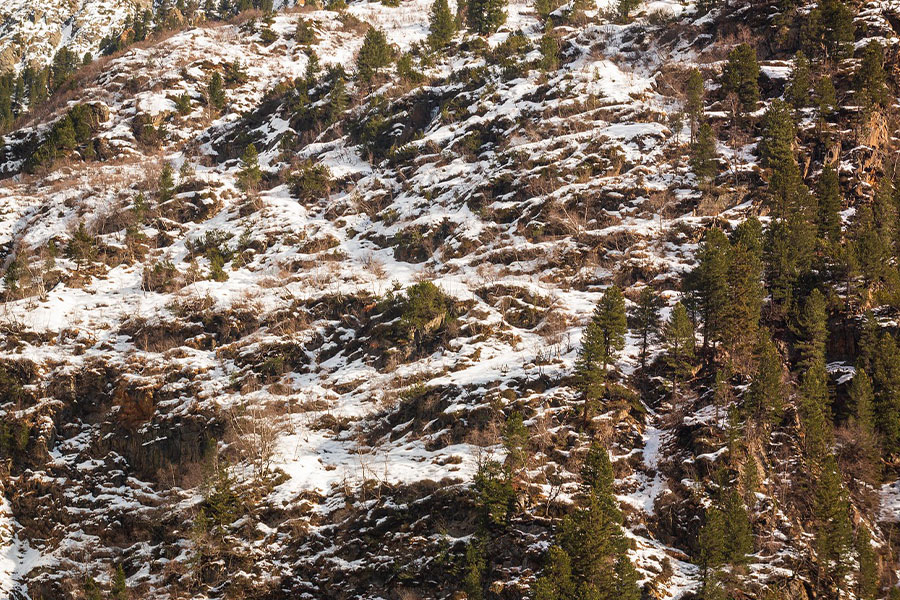 Snowy mountain landscape with steep slope