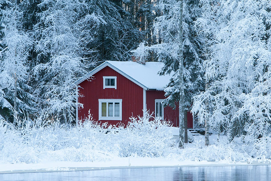 Winter time red sauna cottage