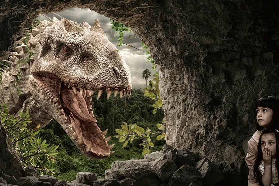 Children cave dinosaur looking