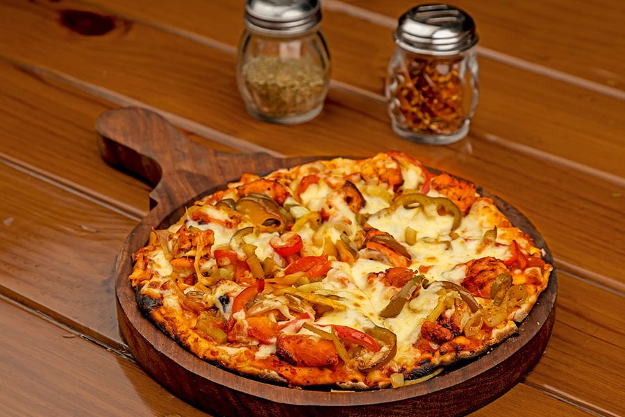 Pizza in wooden tray