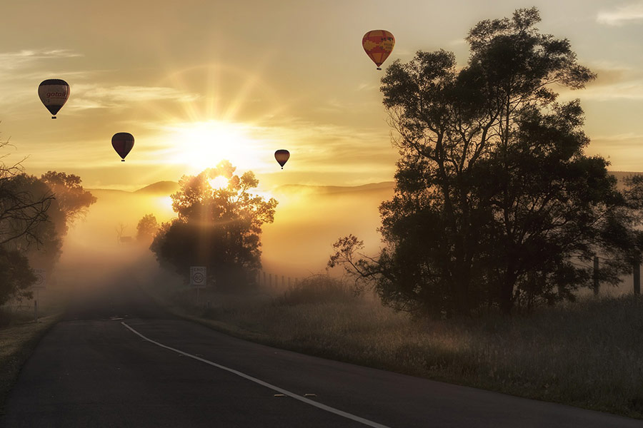 Hot air balloons morning road