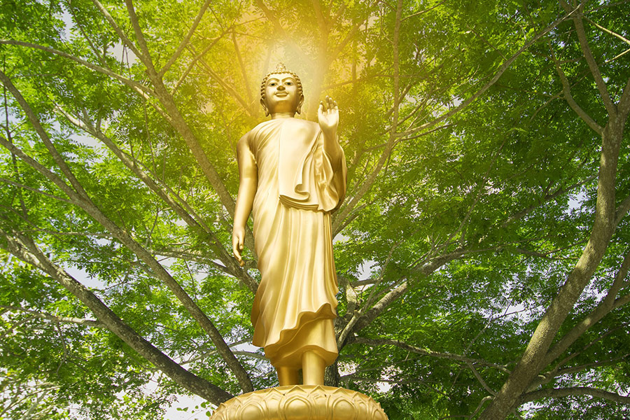 Isolated gold buddha statue Thailand