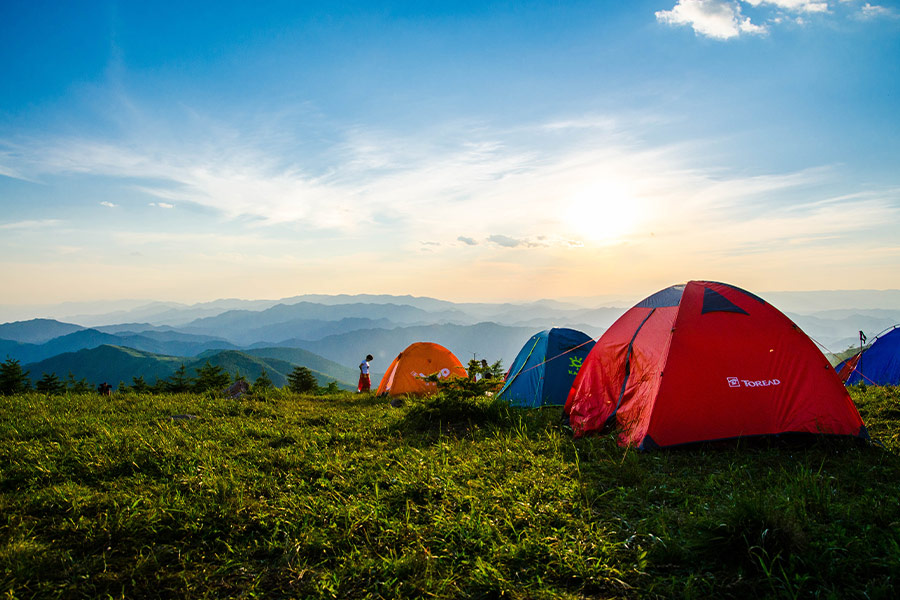 Dome tents overlooking mountain ranges