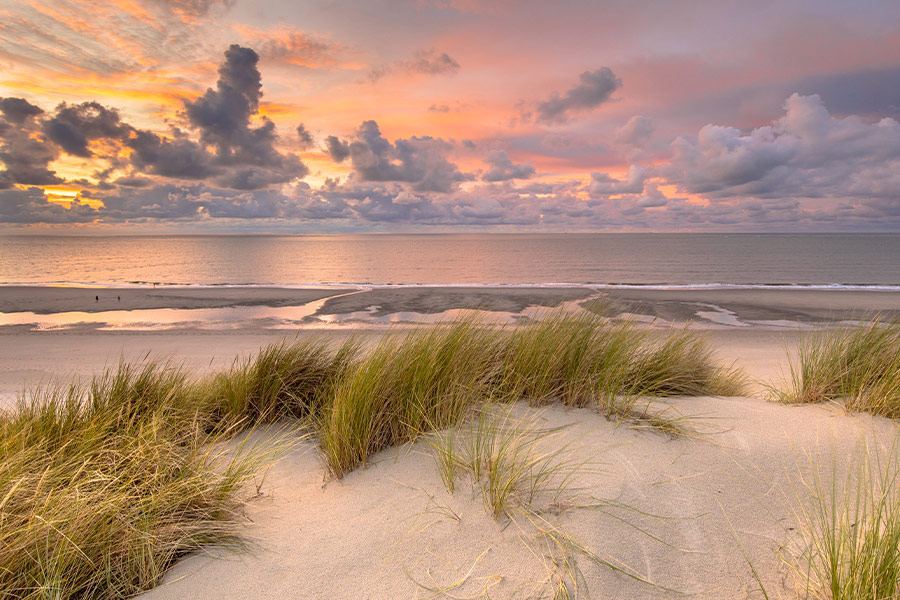 Sunset view North sea and canal Zeeland Netherlands