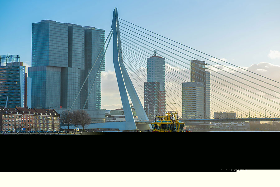 Yellow ship near bridge