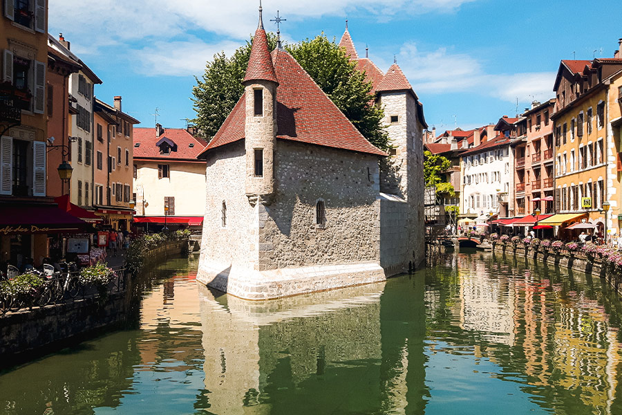 White and brown building near river