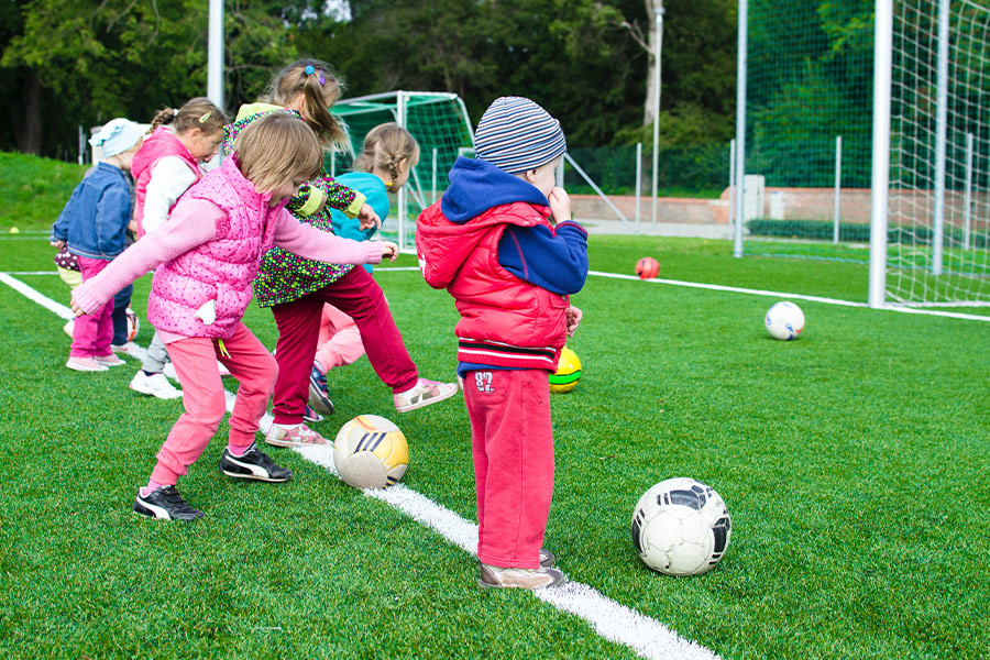 Toddler playing soccer