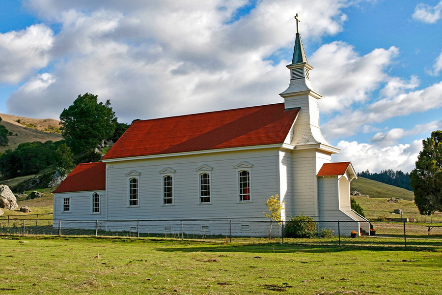 Church on green grass field