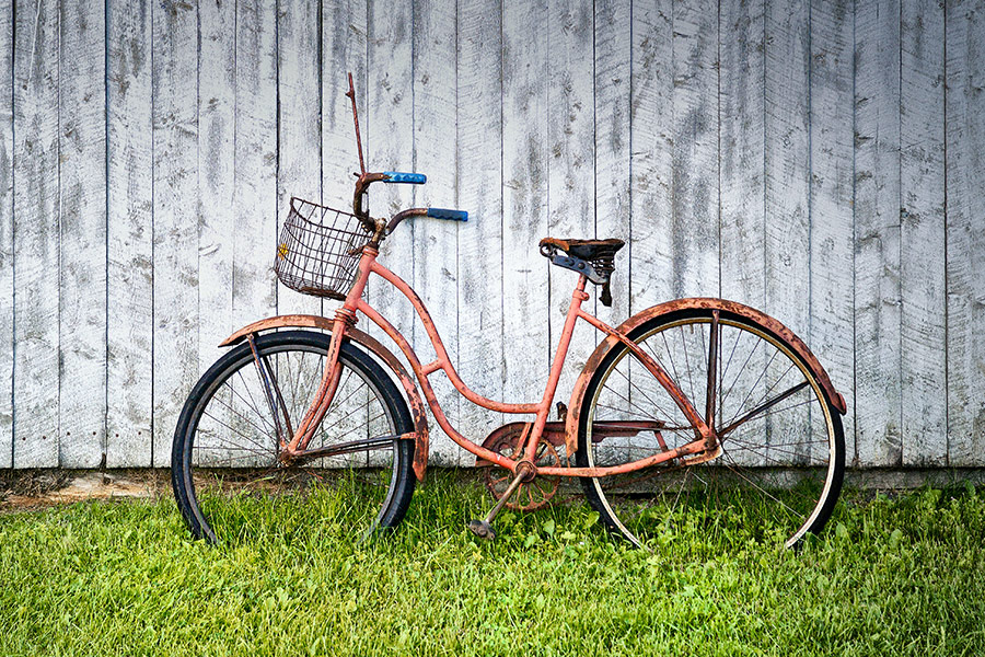 Old pink bicycle parked