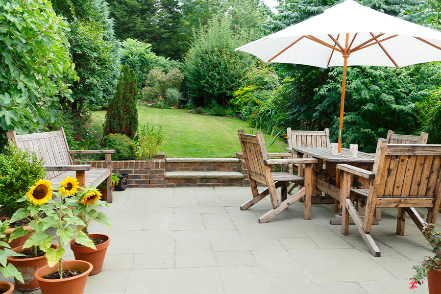 Terrace with garden furniture and parasol
