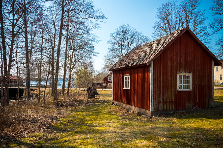 Spring in farm land Sweden old bar rural surroundings