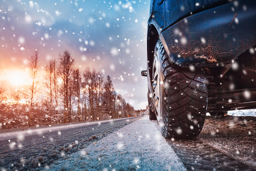 Car tires on winter road