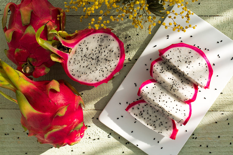 Sliced dragon fruits on ceramic plate