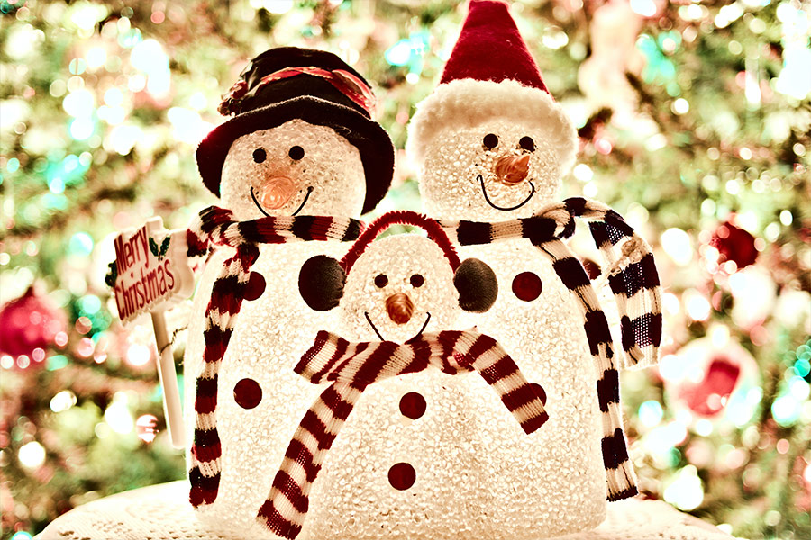 Three white snowman decorations