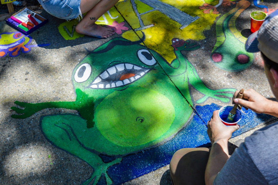 Painting green frog on ground