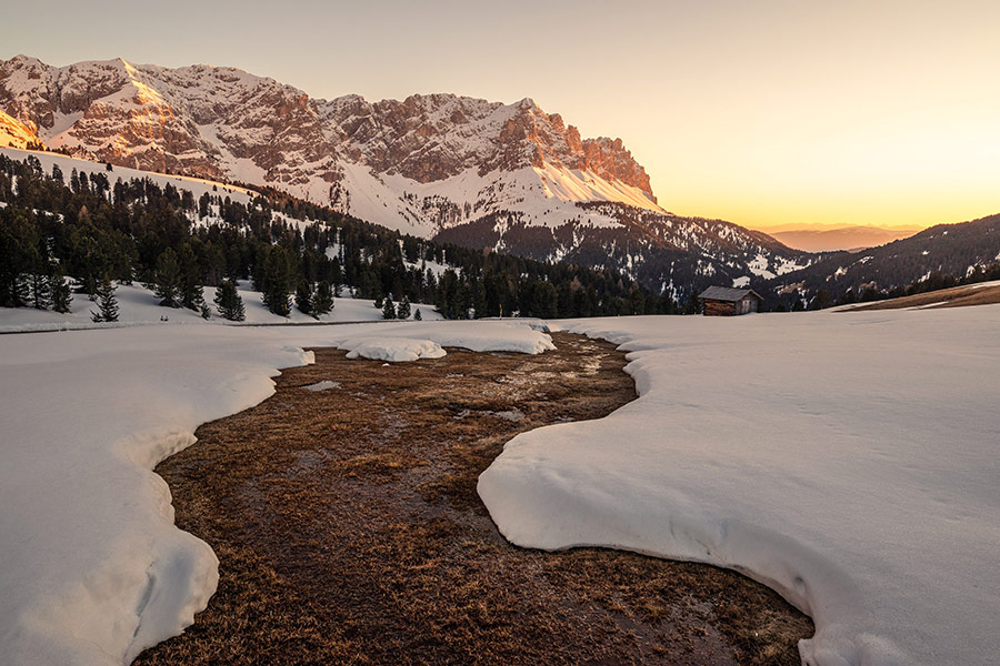 Lake almost covered by snow