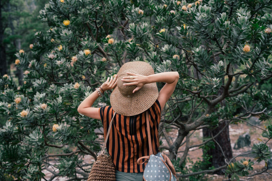 Woman standing near trees