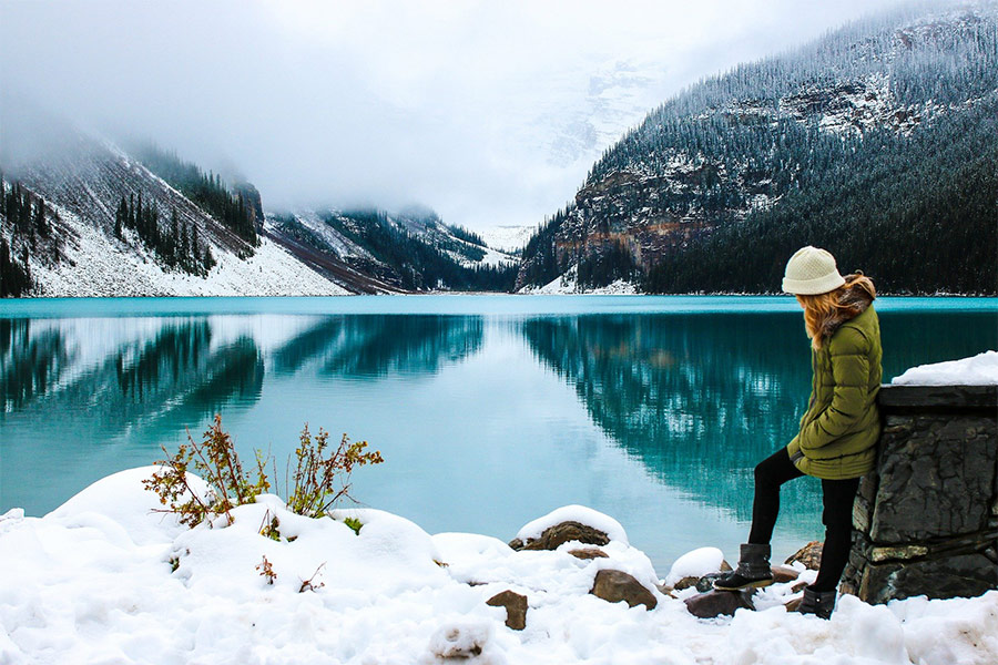 Adventure female hiker in a beatiful lake