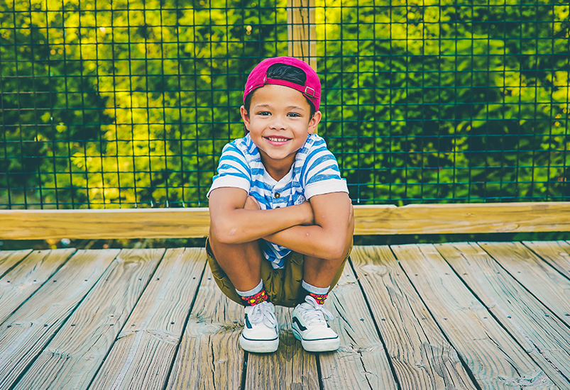 Boy on wooden porch