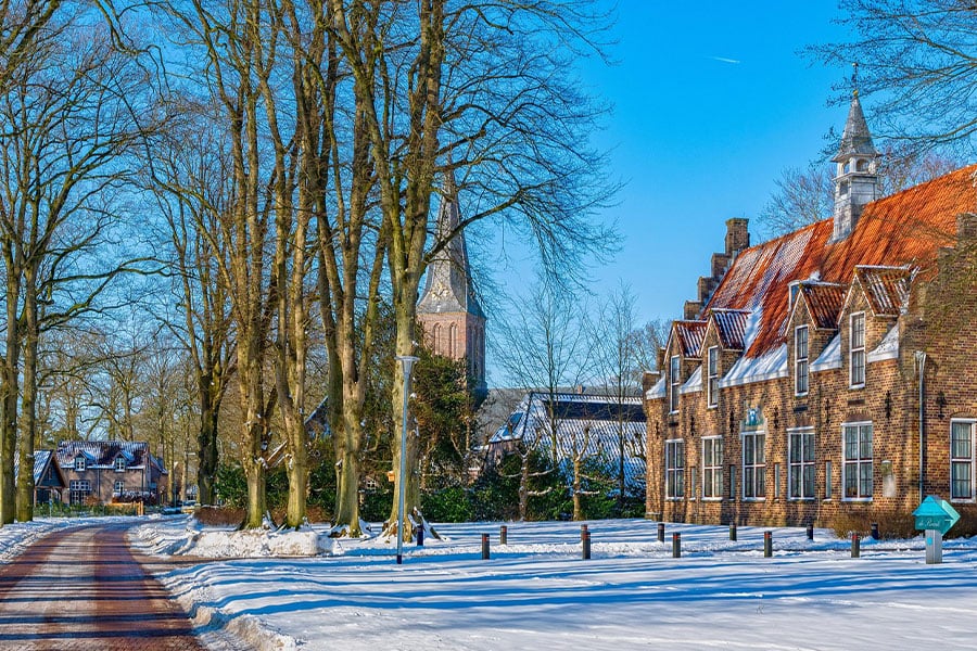 Snowy street scene in Dutch village