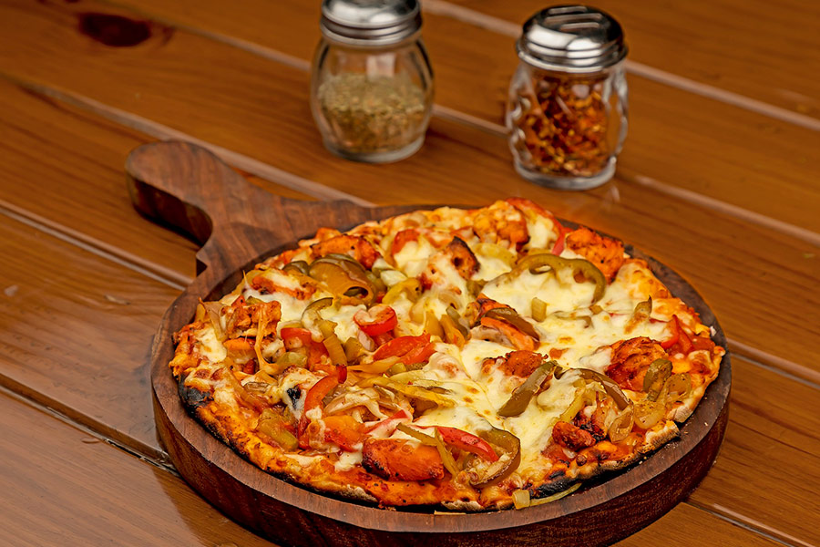 Pizza in wooden tray