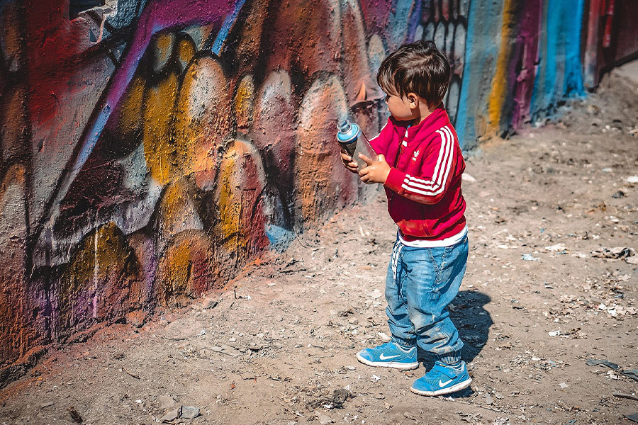 Child with spray paint