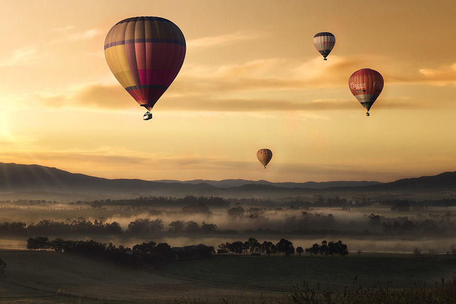 Air balloons sunset field