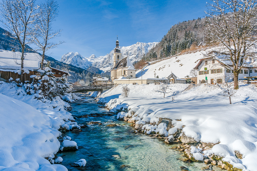 Scenic winter landscape in Alps with church