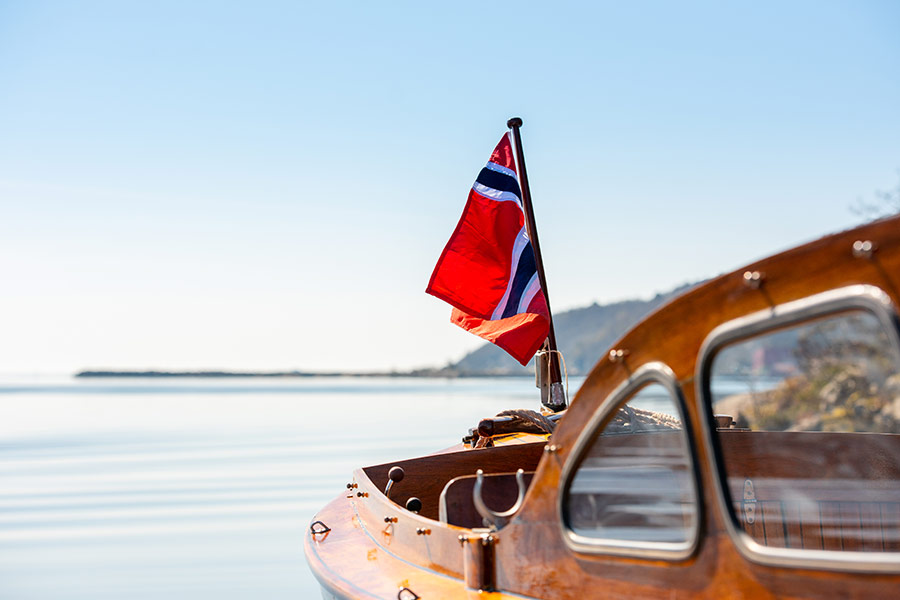 Norwegian flag rear mast wooden boat