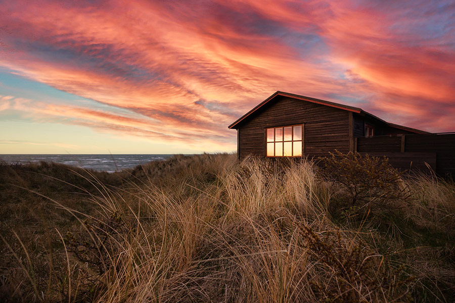 House cabin dunes at sunset