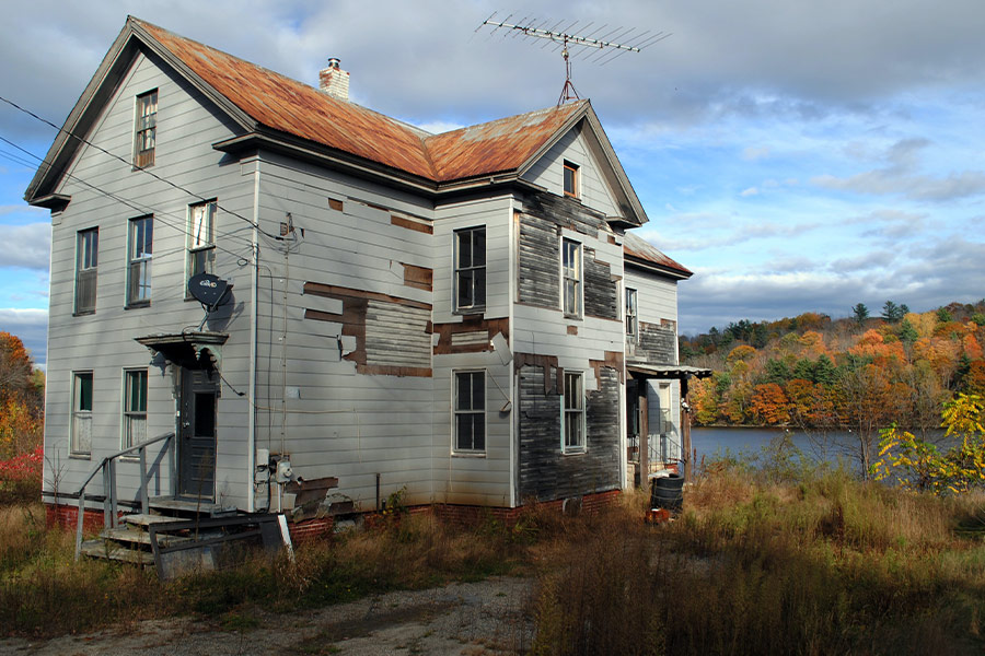 Facade white abandoned house