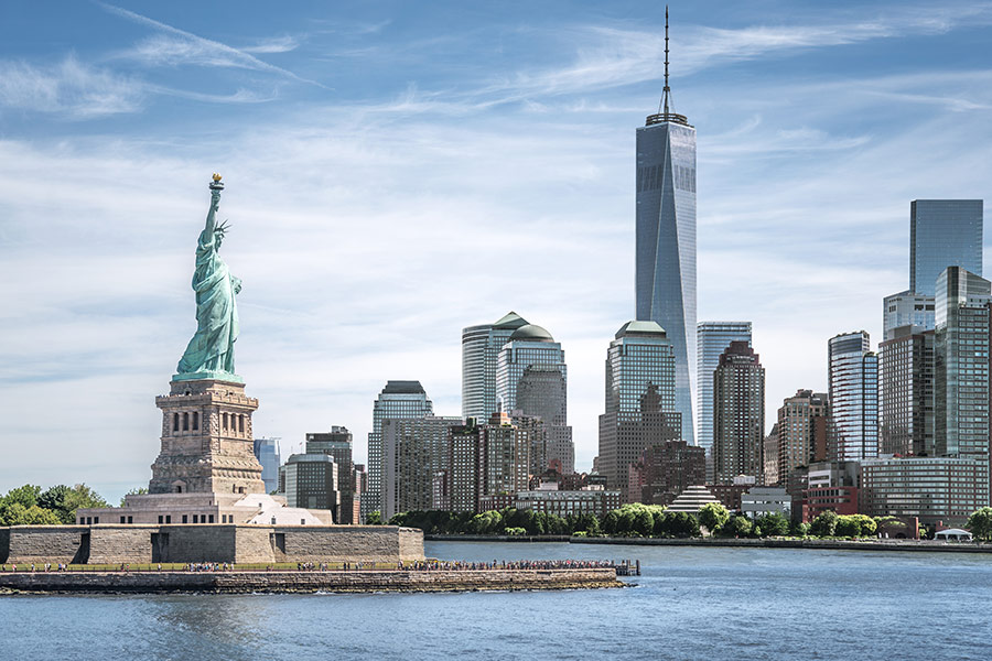 Statue of liberty with one world trade center background