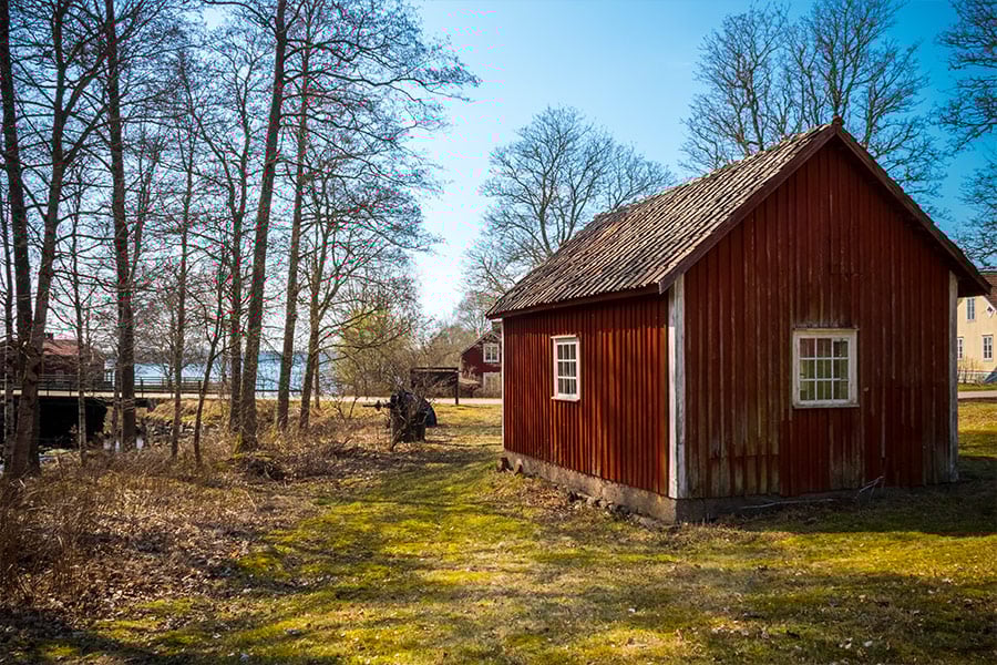 Spring in farm land Sweden old bar rural surroundings