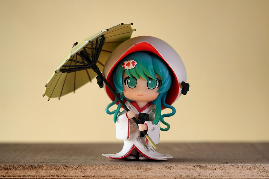 Young lady umbrella figurine
