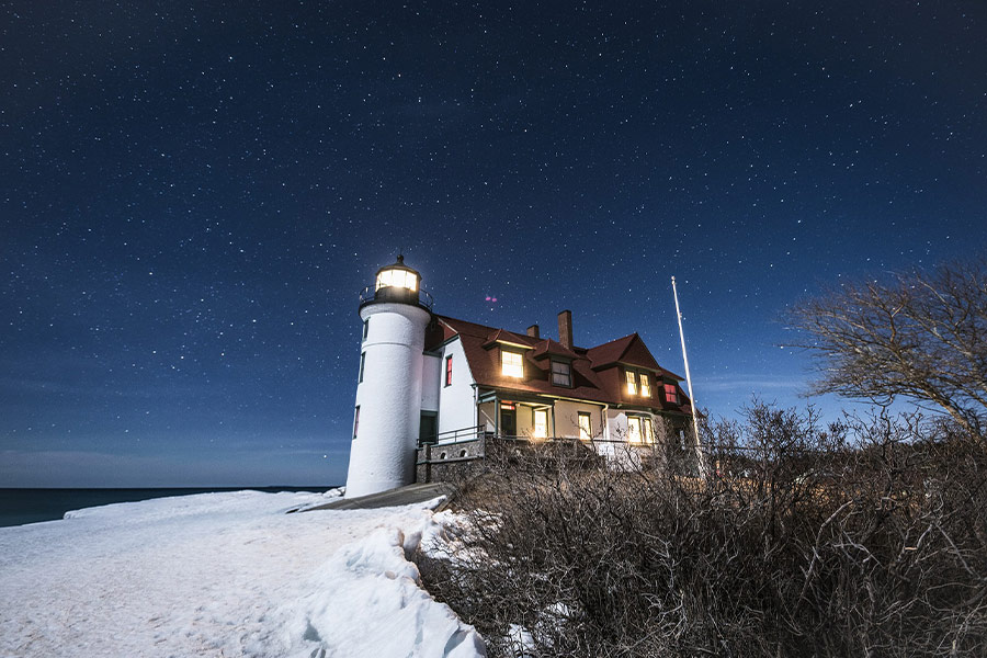 Light house starry sky white snow