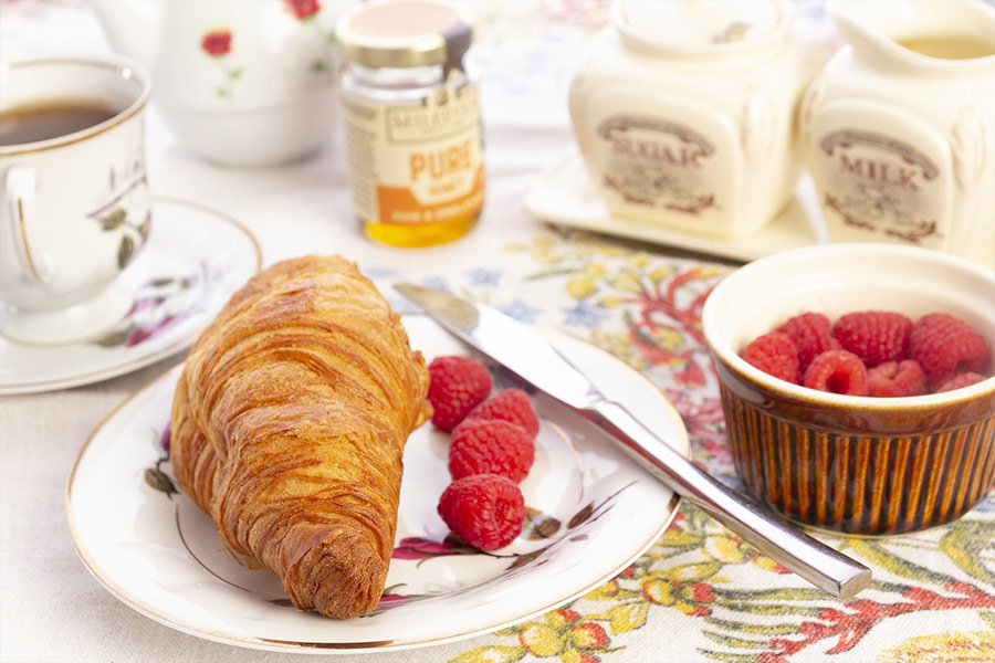 Breakfast croissant bread and raspberry