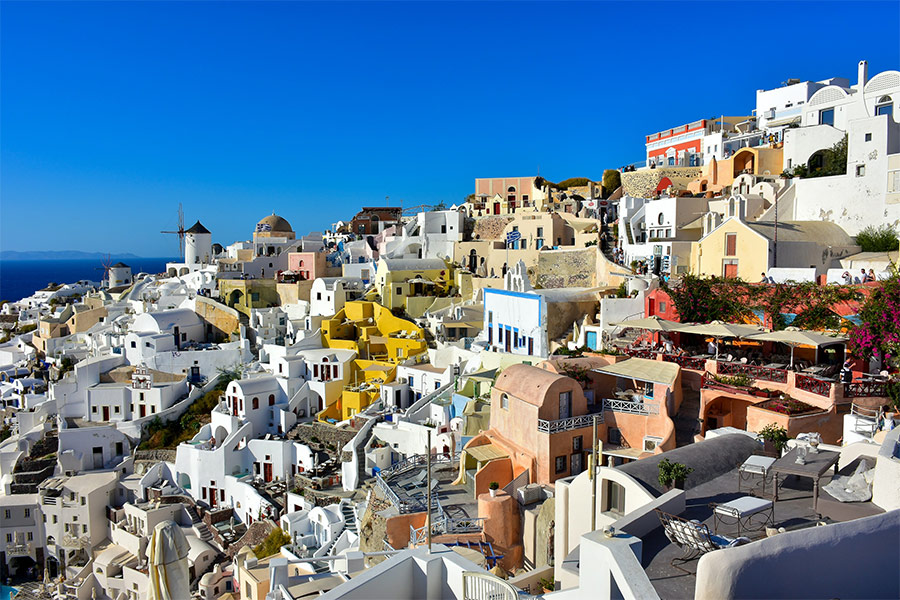 Santorini Grace view of the windmill at Oia castle