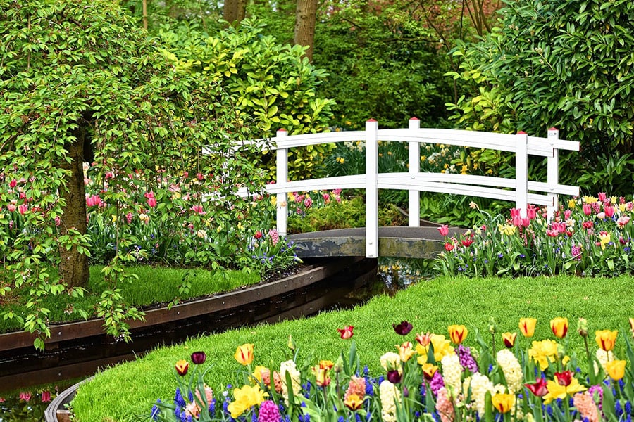White wooden bridge garden