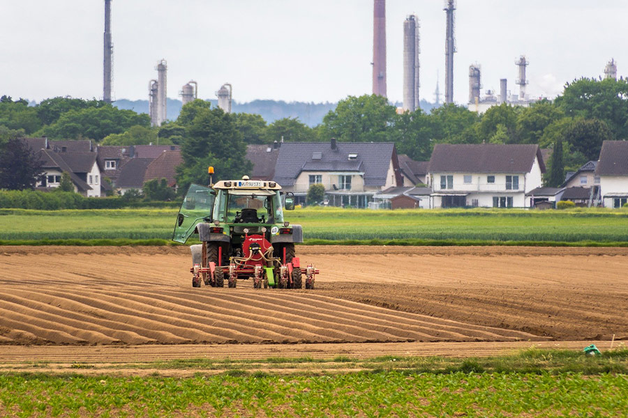 Houses fields tractor chimneys
