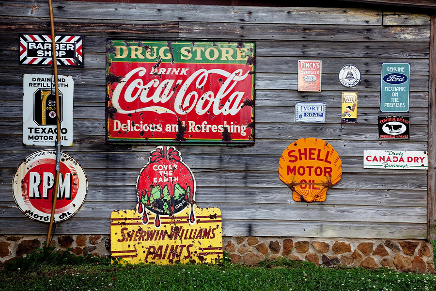 Wooden wall with advertising signs