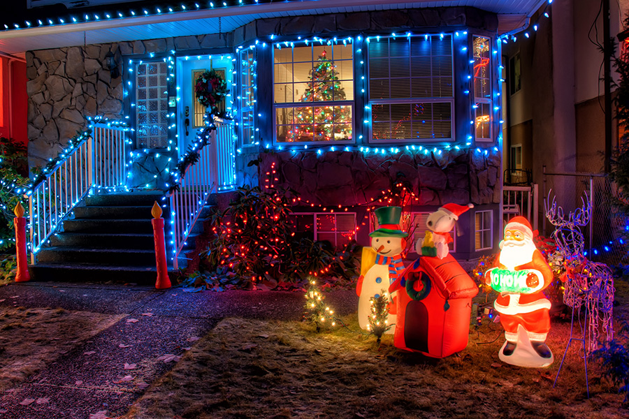 Snowman and Santa Claus near house decor